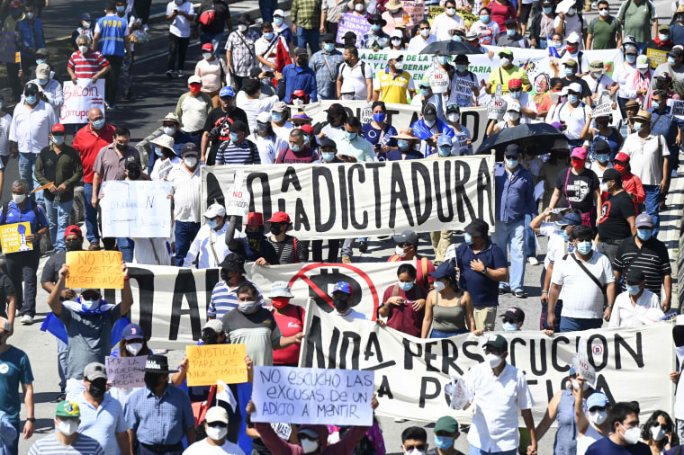 People protest against in San Salvador, El Salvador, on Oct. 17, 2021.