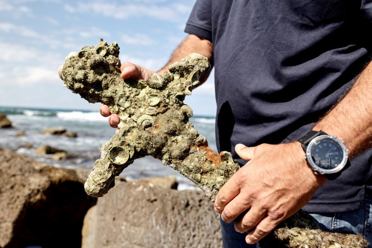 A sword believed to have belonged to a Crusader who sailed to the Holy Land almost a millennium ago was found in Caesarea