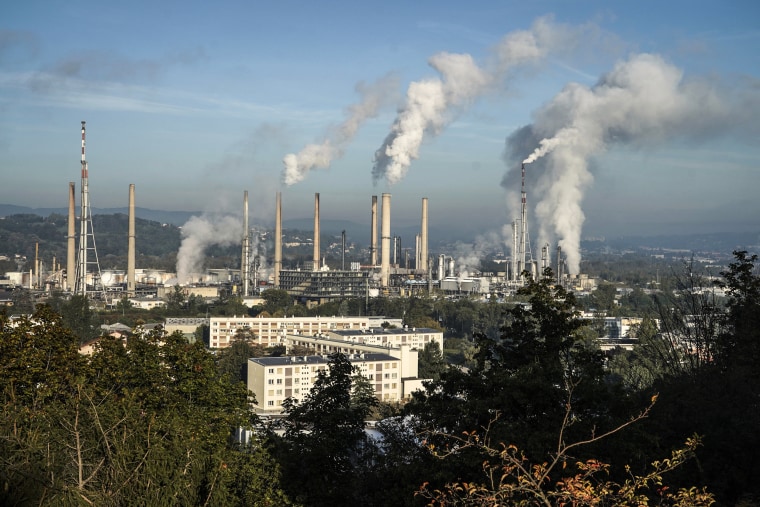 Image: Smoke rises from the Feyzin Total refinery chimneys, outside Lyon, central France on Oct. 15, 2021.