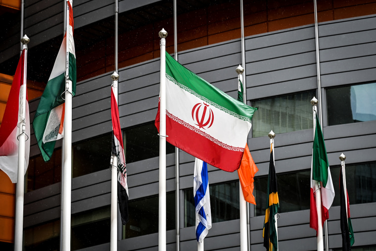 The Iranian flag waves in front of the International Atomic Energy Agency (IAEA) headquarters in Vienna on May 23, 2021.