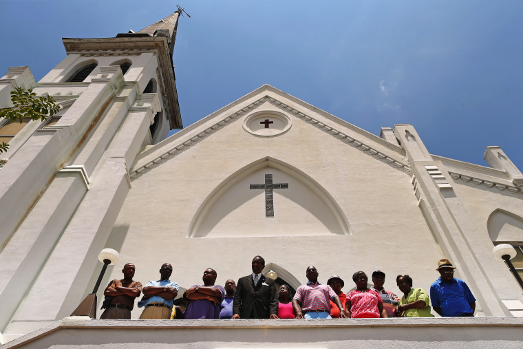 Image: Members of the Emanuel African Methodist Church four days after a pastor and eight others were killed by a gunman in the church on June 20, 2015.