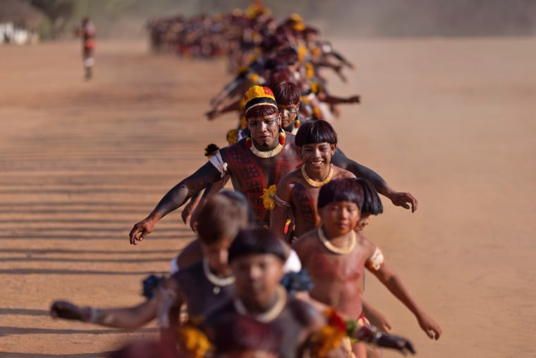 Image: The Wider Image: Rare access captures dances and feasts of Amazonian chief's funeral ritual