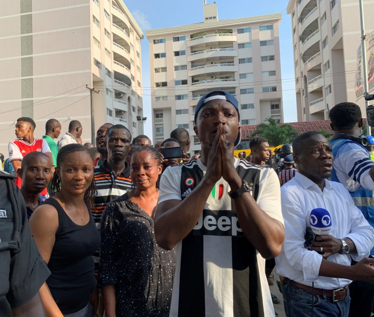 Image: People gather at the site of a collapsed building in Ikoyi, Lagos