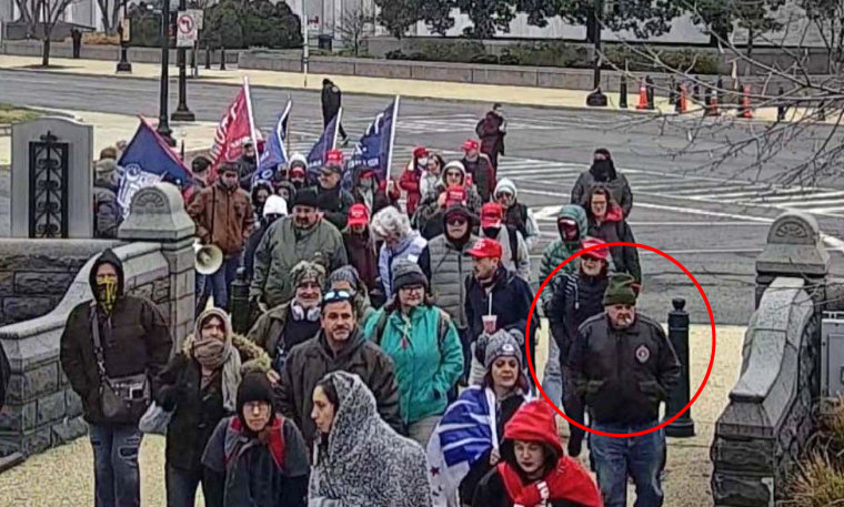 Lonnie Coffman, circled in red, with Trump supporters in Washington on Jan. 6, 2021, in an image from surveillance video.