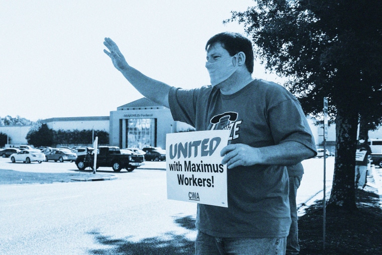 Image: Michael Hodges, Communication Workers of America Union president,  waves to cars outside the Maximus call center to protest conditions in the workplace during the Covid-19 outbreak in Hattiesburg, Miss., on May 1, 2020.