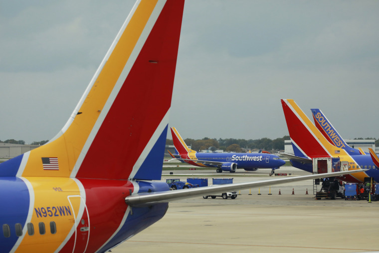 Southwest Airlines passenger jets are parked on the tarmac at Midway International Airport in Chicago on Oct. 11, 2021.