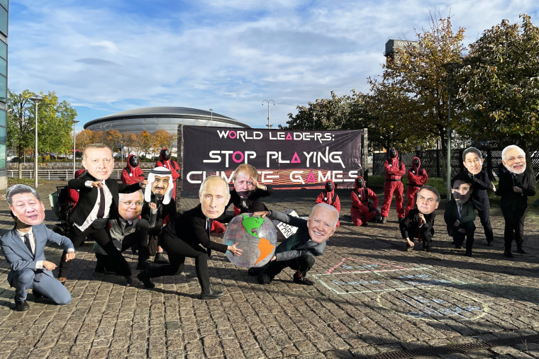 Protesters dressed as world leaders and characters from Squid Game hold a demonstration during COP26 in Glasgow, Scotland, on Nov. 2, 2021.