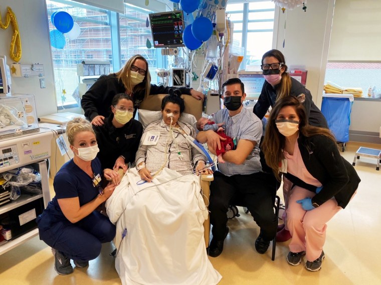 María Roque Díaz and her partner Wilian Molina hold their newborn son Dylan during a surprise baby shower organized by doctors and nurses at the University of Maryland Medical Center and the University of Maryland Children’s Hospital.