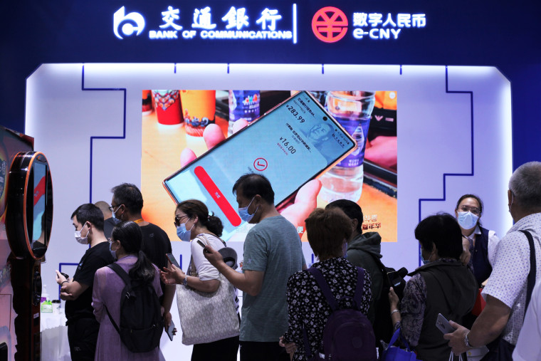 Visitors line up to buy discounted coffees using digital yuan in Beijing on Sept. 7, 2021.