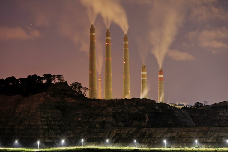 Smoke and steam billows from the coal-fired power plant owned by Indonesia Power in Suralaya, Indonesia, on July 11, 2020.