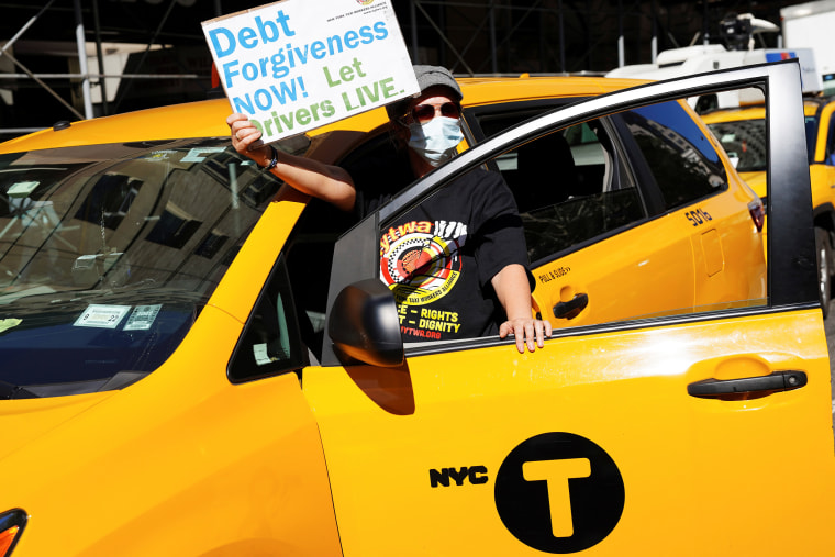 A person attends a protest by New York taxi drivers about debt relief in New York on Oct. 20, 2021.