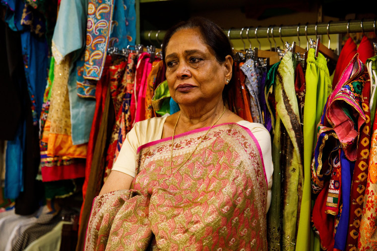 Saroj Goyal cries as she talks about her husband Purushottam Goyal, to whom she was married for 50 years before he died in 2019. They opened their clothing boutique Dress Shoppe in 1977, and renamed it Dress Shoppe II when they moved to their current location in 2001.