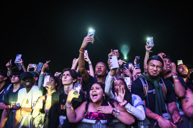 The crowd watches as Travis Scott performs at Astroworld Festival at NRG park on Nov.  5, 2021 in Houston.