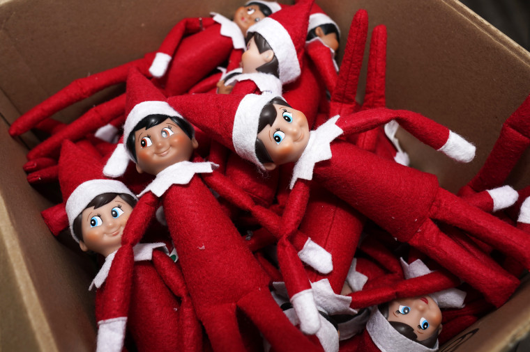 Elf on the Shelf figures are piled in a box at the company's studio on Aug. 27, 2020, in Atlanta.