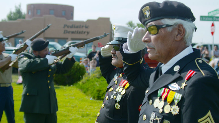 Image: Manuel and Valente Valenzuela saluting the flaf at July 4 festivities in Pueblo, Colo.