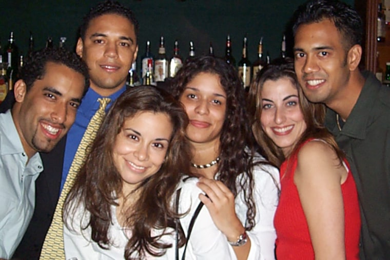 Félix Sánchez, second left, with other young Dominican Americans at Arka Lounge in the Washington Heights neighborhood of New York City on Aug. 29, 2001.