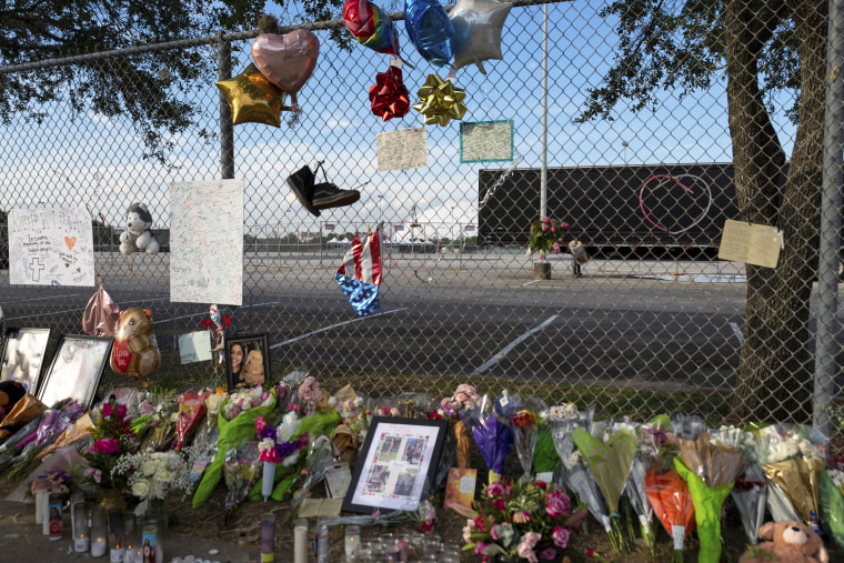 Items hang on a fence at NRG Park in Houston on Nov. 9, 2021, as part of a memorial for those who died in a crowd surge at the Astroworld mustical festival.
