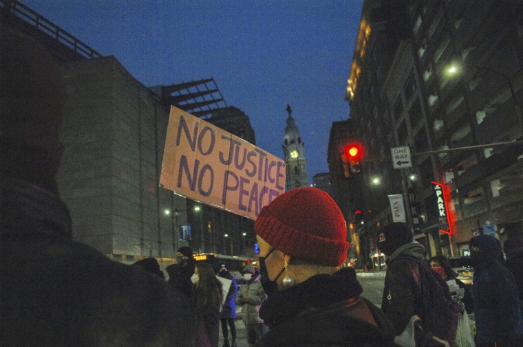 Protesters hold the street for seven minutes in honor of Christian Hall