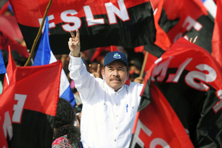 President Daniel Ortega waves to supporters as he arrives at the commemoration of the 39th Anniversary of the Sandinista Revolution in Managua, Nicaragua, on July 19, 2018.