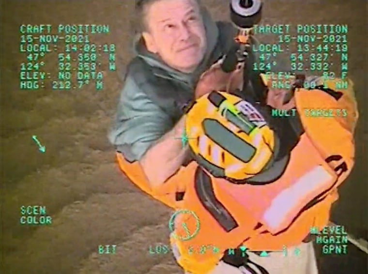 Image: Video grab of U.S. Coast Guard air crew from Sector Columbia River rescuing people from floodwaters near Forks, Washington