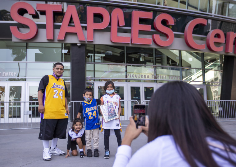 Lakers fans take photos in front of the Staples Center after the Lakers championship win