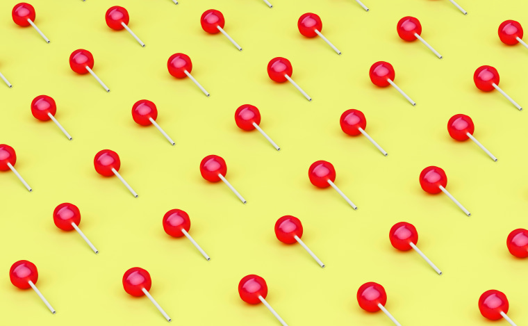 Image: Rows of red lollipops