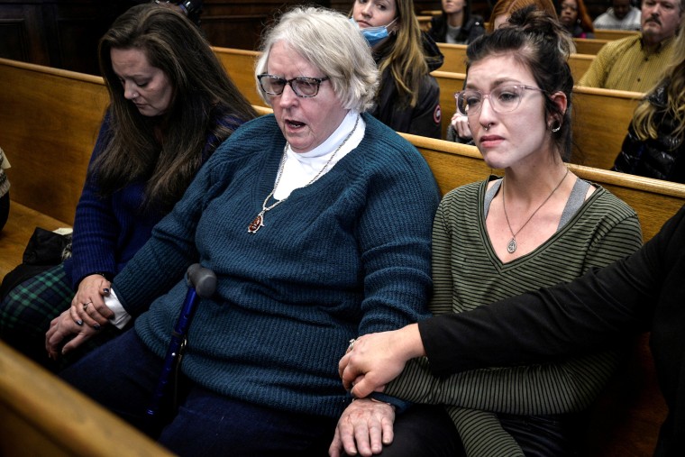 Image: From left, Kariann Swart, Joseph Rosenbaum's fiancee, Susan Hughes, Anthony Huber's great-aunt, and Hannah Gittings, Anthony Huber's girlfriend, listen to the verdict during Kyle Rittenhouse's trial at the Kenosha County Courthouse in Kenosha, Wisc., on Nov. 19, 2021.