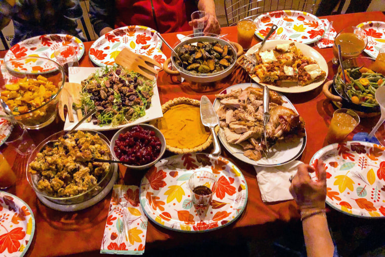 Raj's Thanksgiving dinner table, featuring a multicultural spread made by his family.