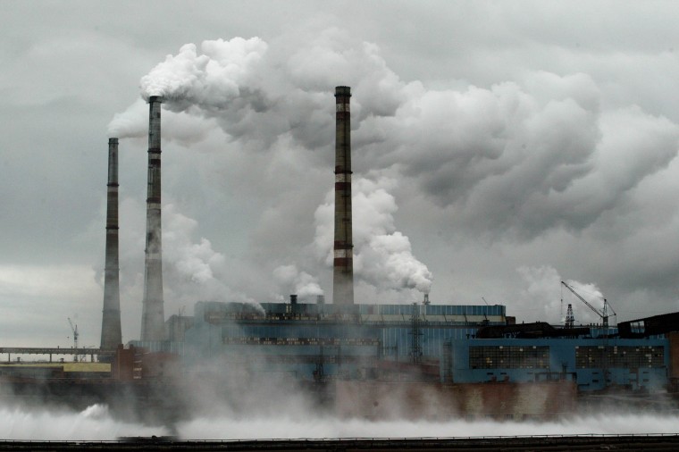 Image: Smoke stacks for a nickel-refinery spew sulfur dioxide into the environment July 21, 2002 in Norilsk, Russia.