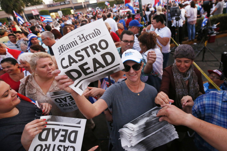 Alexandra Villoch, president and publisher of the Miami Herald Media Company, hands out a special edition of the Miami Herald with the headline "Castro Dead," in front of the Versailles Restaurant in the Little Havana neighborhood of Miami on Nov. 26, 2016.