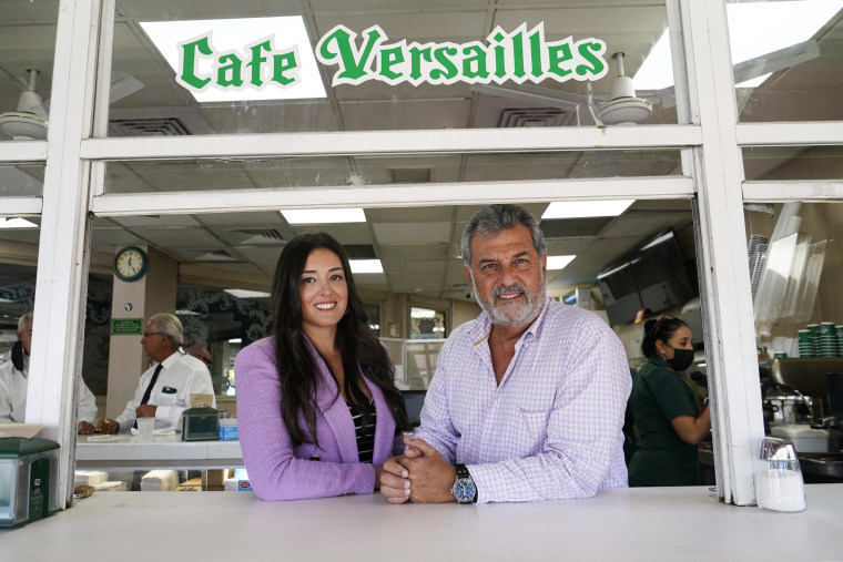 Felipe Valls Jr., right, owner of Versailles Restaurant, right, poses for a photograph with his daughter Nicole Valls at Versailles Restaurant in Miami on Aug. 30, 2021.