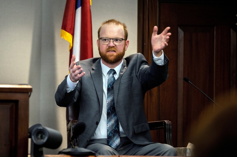 Image: Travis McMichael speaks from the witness stand, in Brunswick, Ga., on Nov. 17, 2021.