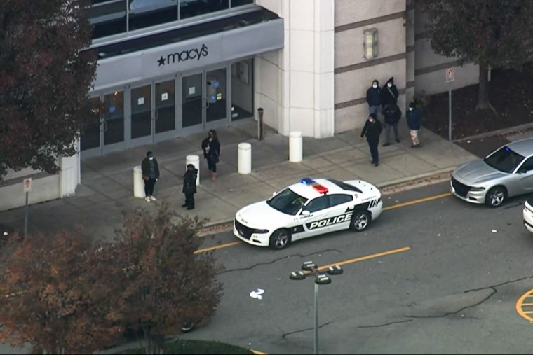 Police respond to a shooting at a mall in Durham, N.C., on Nov. 26, 2021.
