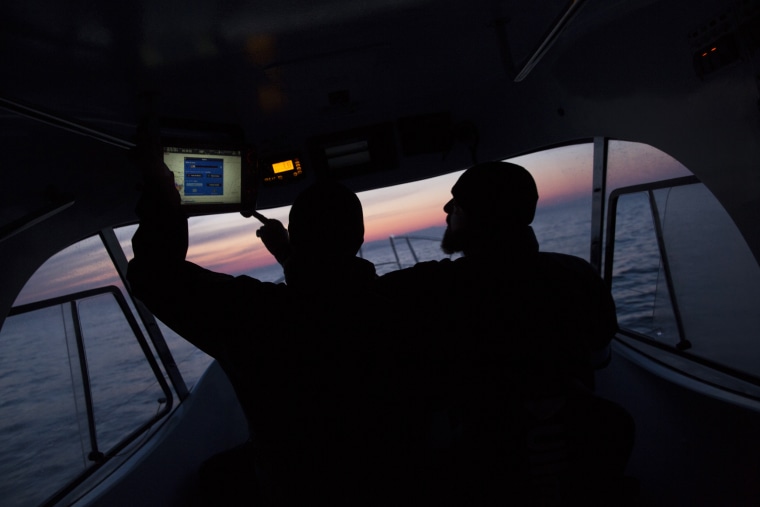 Portuguese Frontex crew check coordinates as they monitor the Aegean sea between Turkey and Greece for boats carrying refugees on March 30, 2016, near Mithymna, Greece.