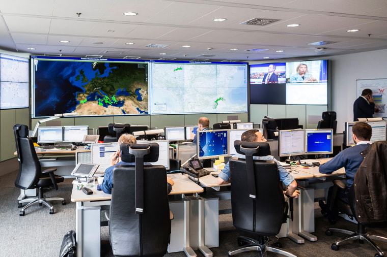 Employees work in the situation room at the headquarters of the European Union border force Frontex in Warsaw, Poland, on Sept. 29, 2015.