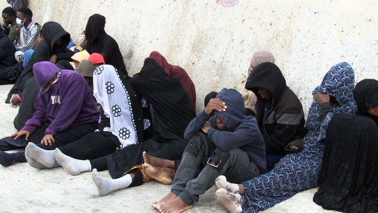 Migrants wait to be returned by Libyan Coast Guard off the coast of Garabulli, Libya, on Oct. 19, 2021.