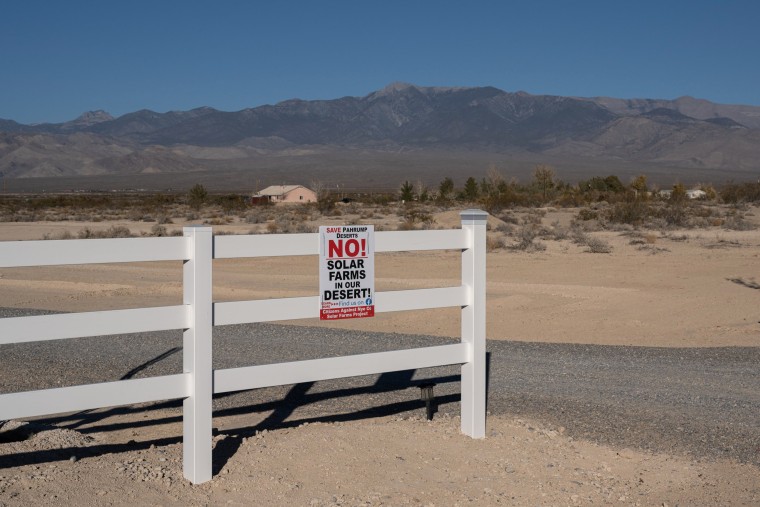 A residence displays a sign opposing solar projects in Pahrump, Nev., on Nov. 27, 2021. Candela Renewables, a San Francisco-based renewable energy company, hopes to build a large-scale solar field across some 2,300 acres bordering Pahrump.