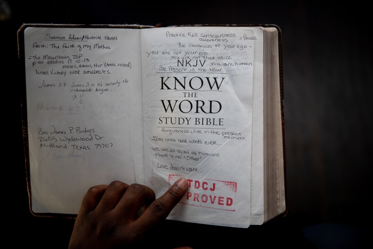 Image: Tahj Graham with the bible he kept with him while incarcerated in the Texas Department of Criminal Justice women's prison in Gatesville, Texas.