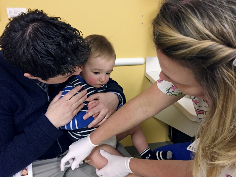 A 15-month-old receives the measles, mumps and rubella booster shot at a clinic at Children's Minnesota in Minneapolis in 2017.