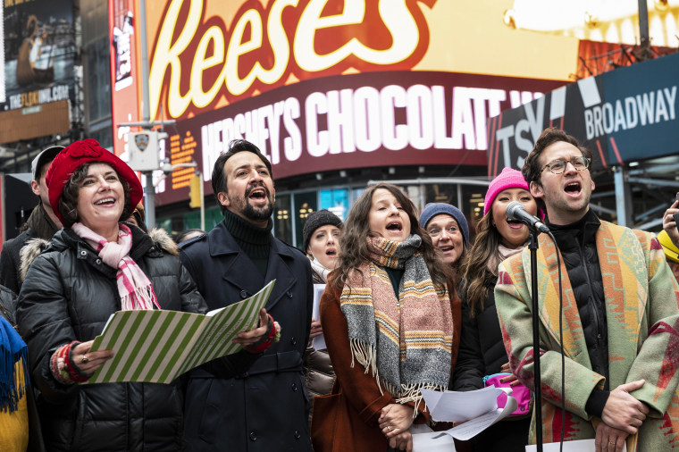Broadway stars stand on the red steps of Duffy Square to perform "Sunday" from Sondheim's 1984 Pulitzer Prize-winning musical Sunday in the Park with George, on Nov. 28, 2021.