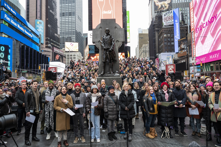 Broadway stars stand on the red steps of Duffy Square to perform "Sunday" from Sondheim's 1984 Pulitzer Prize-winning musical Sunday in the Park with George, on Nov. 28, 2021.