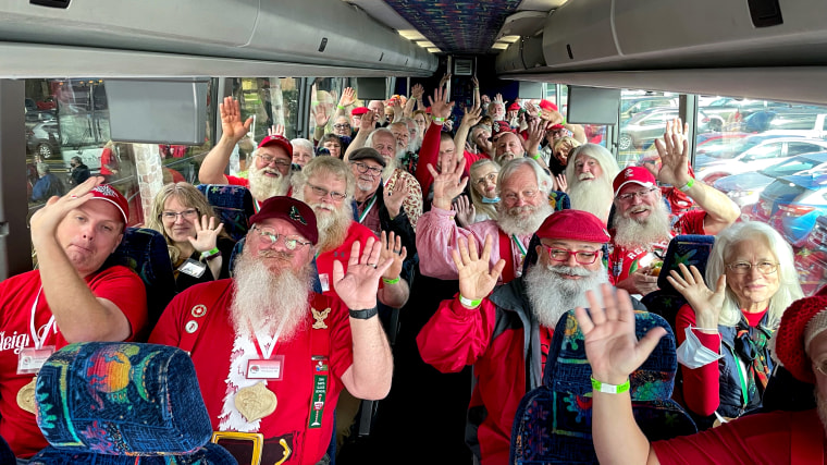 A group of Santas at the Charles W Howard Santa School head out on a field trip. A good reminder that Santa Claus, and all these Santa Clauses, are headed to town.