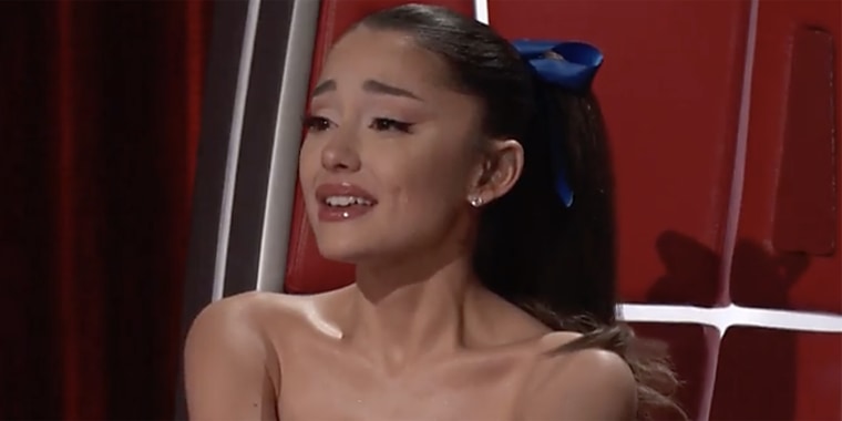 Ariana Grande sobs as she watches her team members Jim and Sasha Allen be put up for elimination on the November 23 episode of "The Voice."