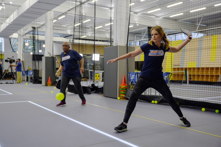 Savannah gets ready to smash the ball, while teammate Al looks on.