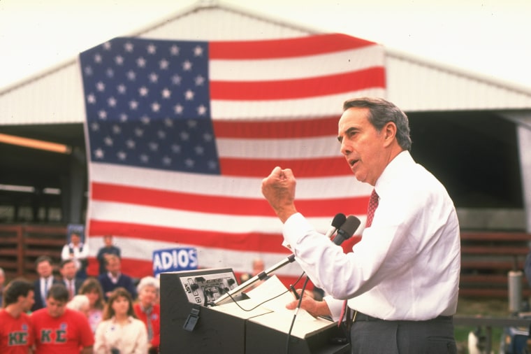Sen. Bob Dole, R-Kan., speaks at a stockyard rally during his Republican presidential primary campaign in 1988.