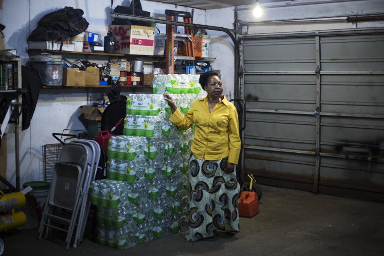 Darlene McClendon keeps bottles of water at her home in Flint, Mich., on Oct. 11, 2016.