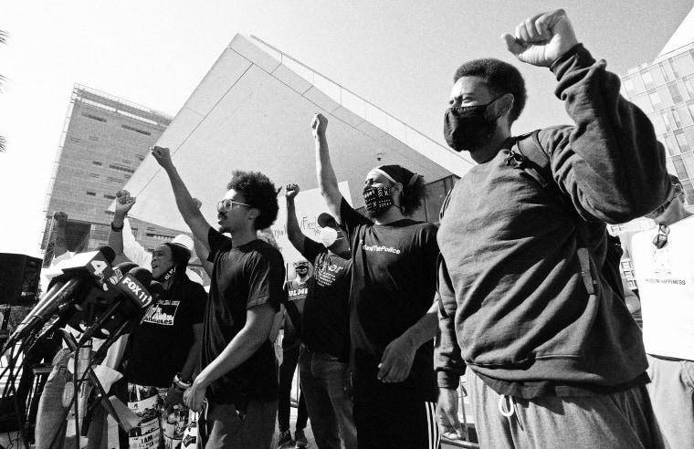 Image: Black Lives Matter protesters outside of the LAPD headquarters on July 20, 2021. Protesters were demanding answers and reparations after the LAPD detonated illegal fireworks that injured residents and police officers in a South Central neighborhood in June.
