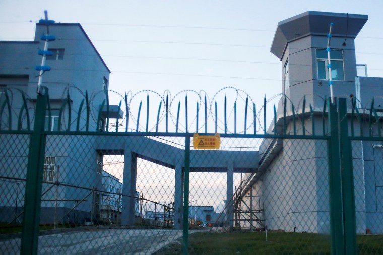 A perimeter fence is constructed around what is officially known as a vocational skills education centre in Dabancheng