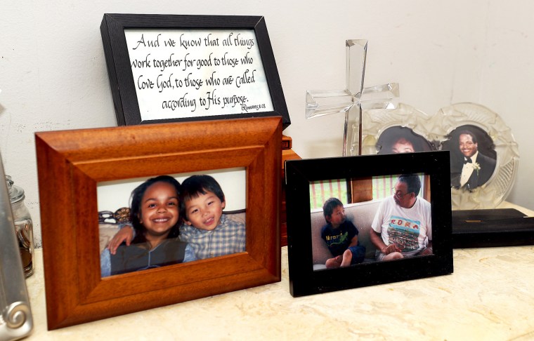 Image: Framed childhood photos of Christian Hall and family.