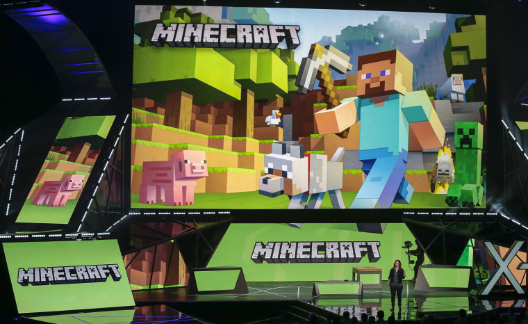Lydia Winters shows off Microsoft's "Minecraft" built specifically for HoloLens at the Xbox E3 2015 briefing before Electronic Entertainment Expo, June 15, 2015, in Los Angeles.